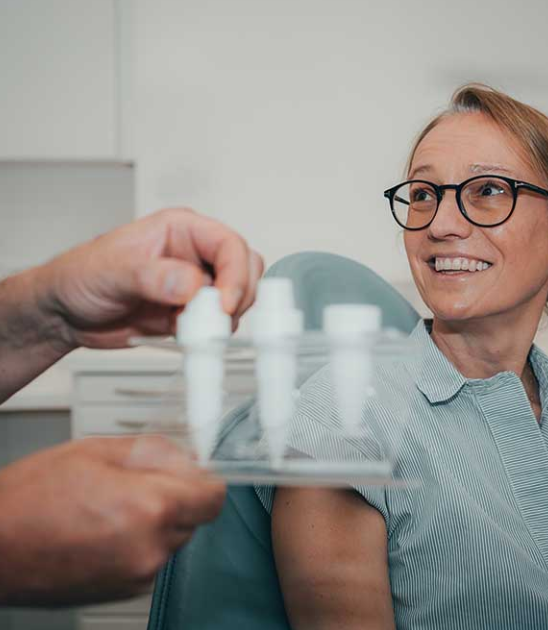 Ceramic implant consultation with a Confident Smile clinician showing SDS zirconia implants