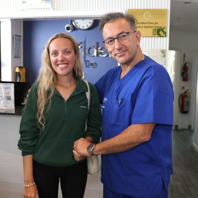 Dr Alex Hashemi with a patient
