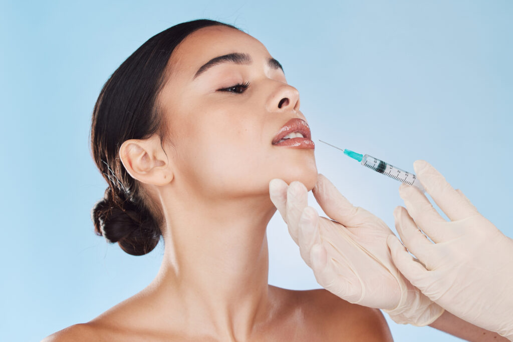 Dr Kiran applying dermal fillers in Shepperton