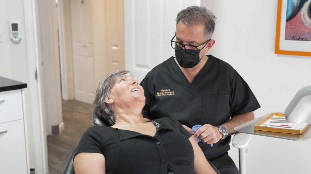 Dr Alex Hashemi with a patient at Confident Smile Dental Practice, Shepperton